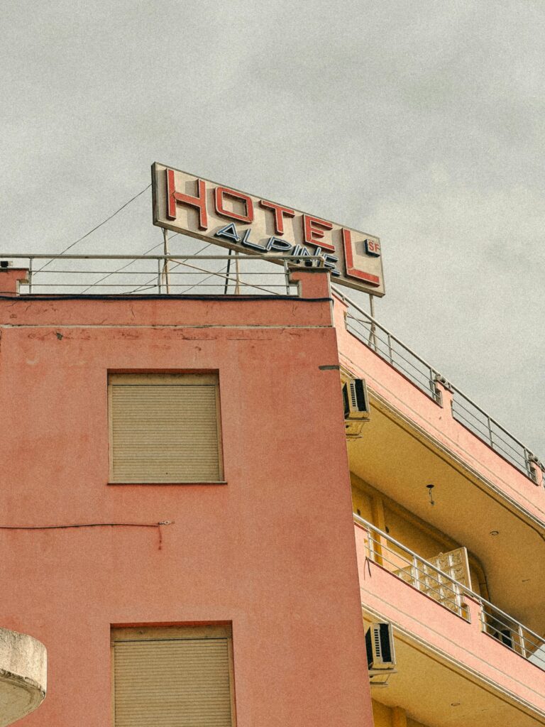 The Evolution of Hotel Booking: Why Vintage Boutique Hotels are Leading the Way - Photo of a pink hotel facade